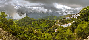 green mountains under white cloudy sky