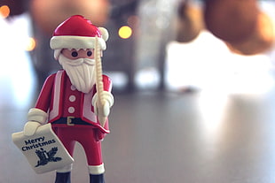 depth of field photography of Santa Clause mini figure