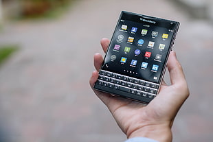 black Blackberry qwerty phone turned on