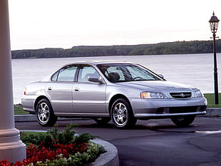 silver sedan on gray asphalt road near body of water during day time HD wallpaper