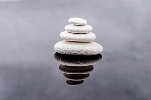 front view of a four piece stack of stones HD wallpaper