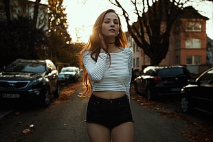 woman wearing white and black crop-shirt and black shorts