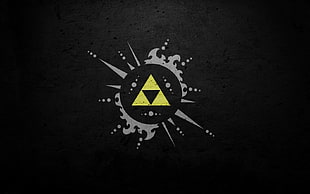 black and yellow triangle logo