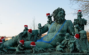 statues with Santa Claus hats