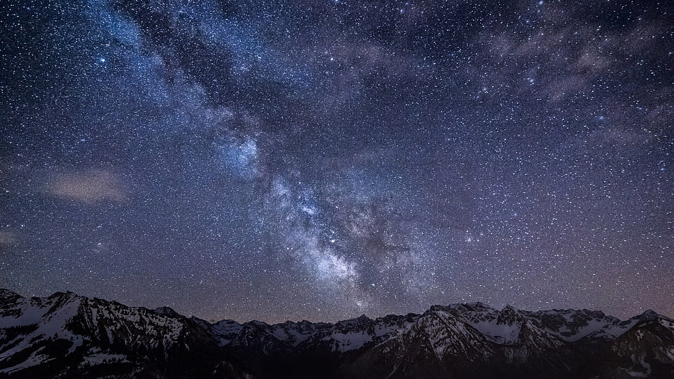mountain under star during nighttime HD wallpaper