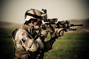 soldier holding gun HD wallpaper
