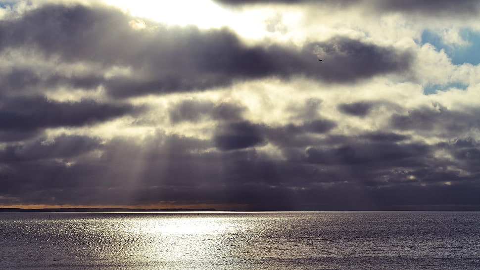 dark clouds with sun rays HD wallpaper