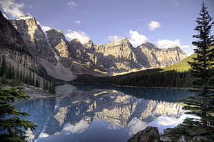 body of water surrounded by trees and mountain, moraine lake