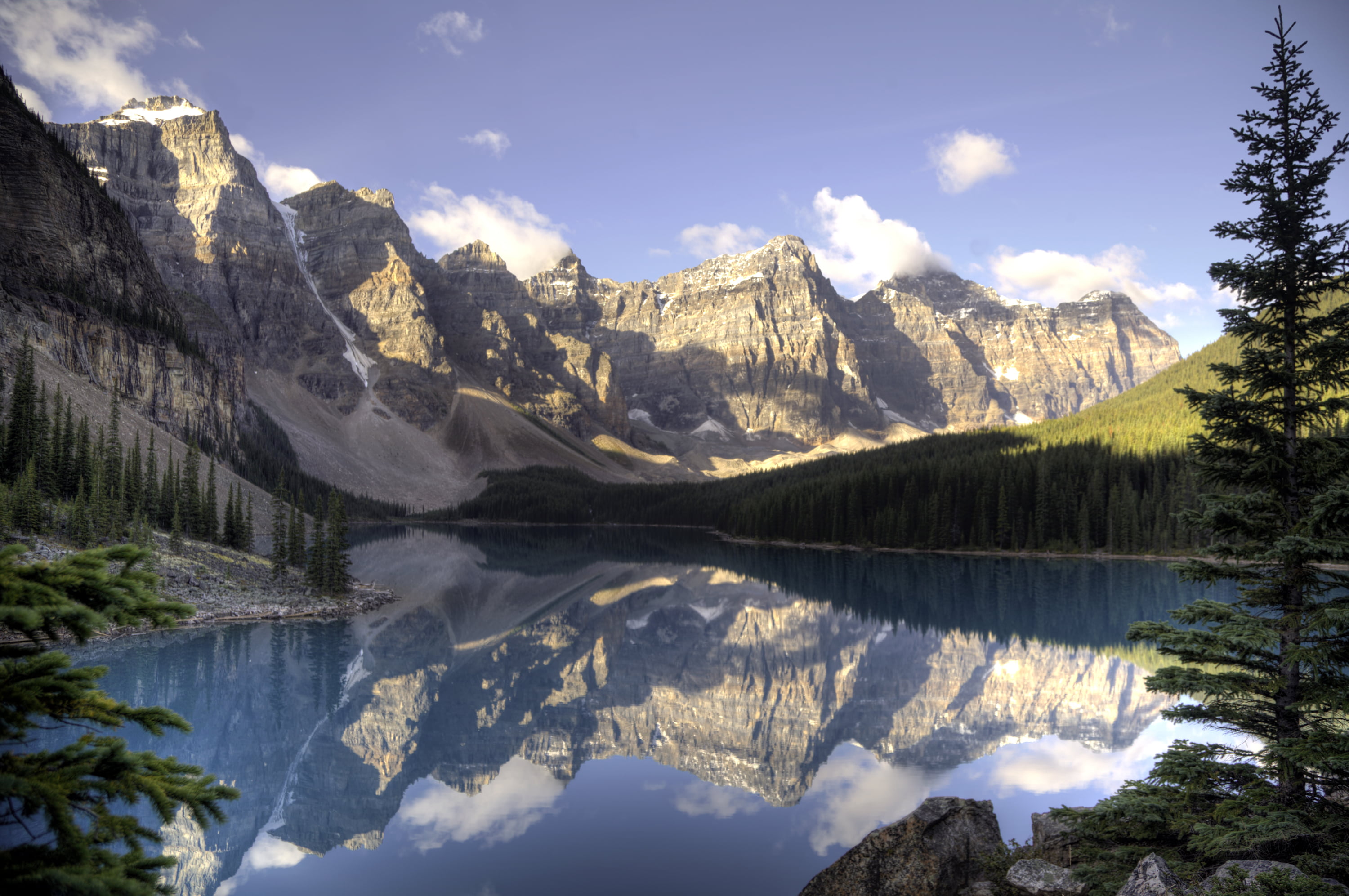 body of water surrounded by trees and mountain, moraine lake