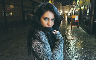 photo of woman wearing knitted sweater