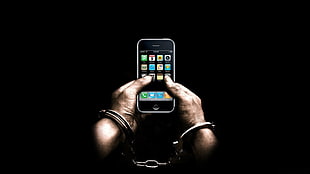 man in cuff links holding black iPod Touch HD wallpaper