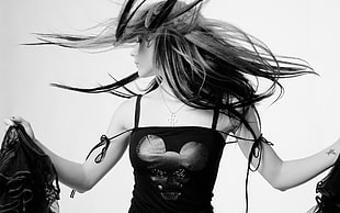Woman wearing black spaghetti strap top photo