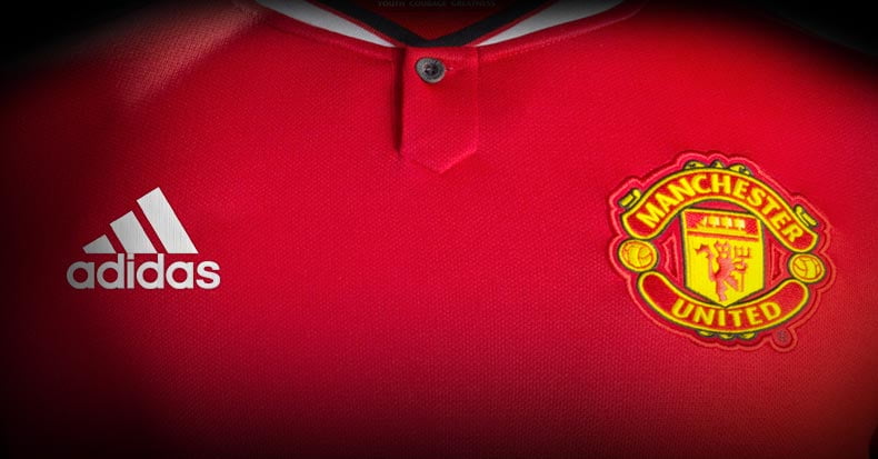 shallow focus of red Adidas soccer jersey\
