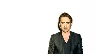 portrait photo of man wearing suit jacket