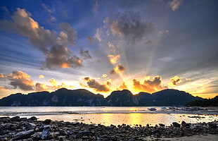 panoramic photo of mountains during sunrise