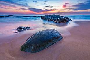 black rock formation near sea photo shot during daytime HD wallpaper