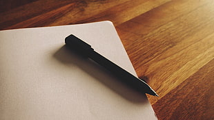 black pen on white table