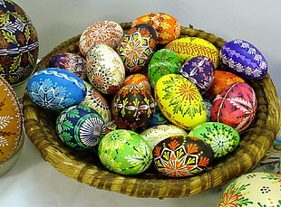 assorted Easter eggs on brown basket