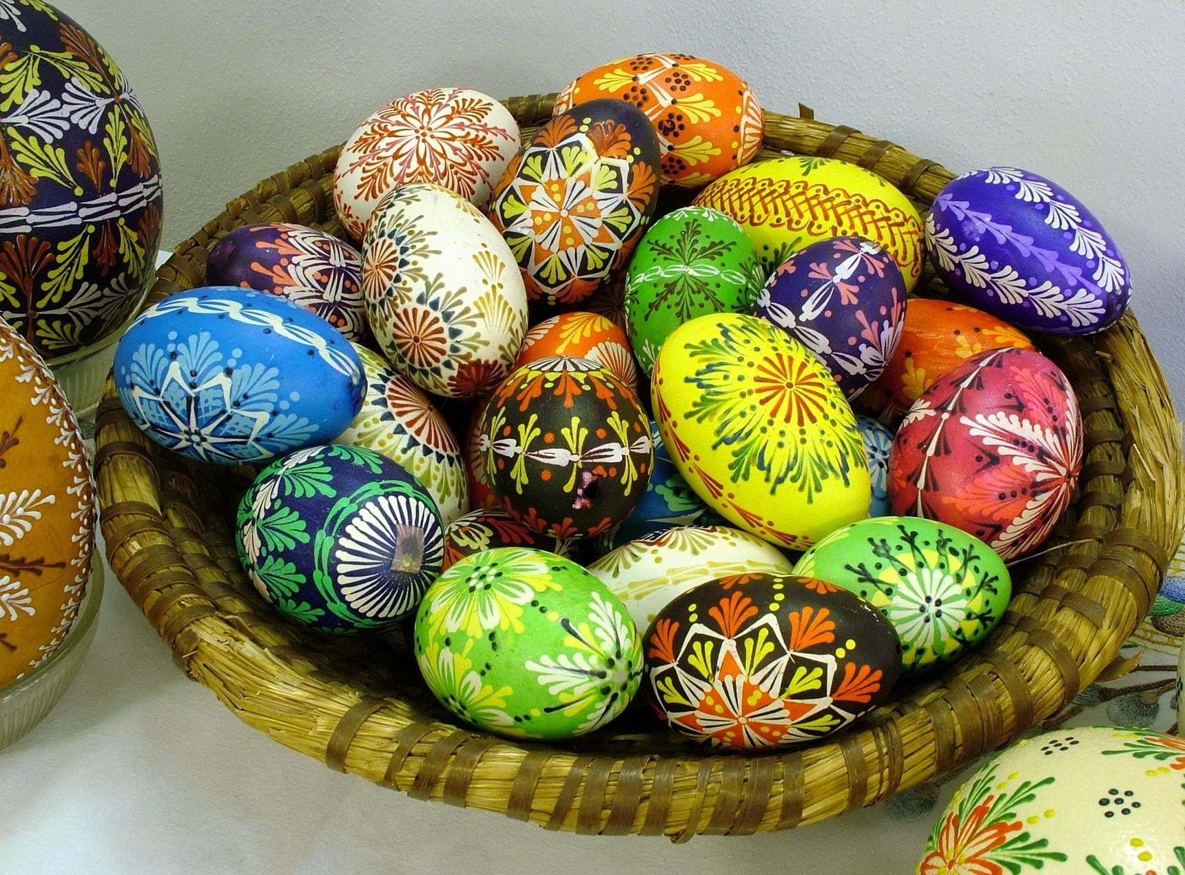 assorted Easter eggs on brown basket
