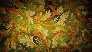 green and beige floral fabric surface