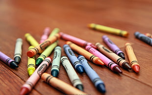 Crayola Crayons lot on brown wooden surface