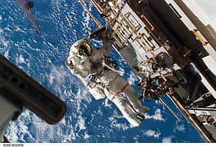 white astronaut during daytime photo