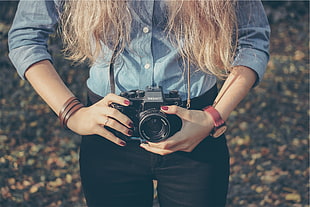 woman holding camera HD wallpaper