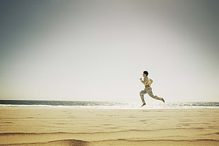 person Running on seaside HD wallpaper