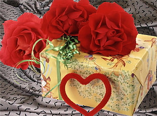 square yellow floral print gift box with red Rose flowers on top