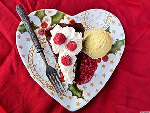 slice of strawberry cake with heart shape plate
