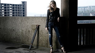 woman wearing black leather jacket and denim pants HD wallpaper