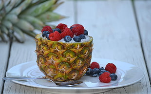 pineapple with raspberry and blueberries