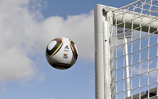 white and brown soccer ball