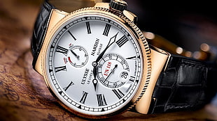 round silver-colored chronograph watch with link bracelet, watch, luxury watches, Ulysse Nardin