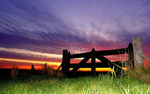 brown wooden fence during sunset
