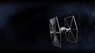 black and white Tie Fighter flying in space