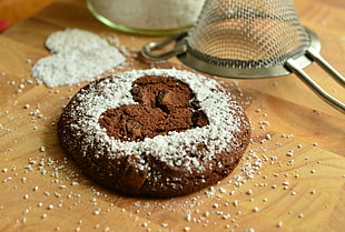 cookie with heart on brown surface