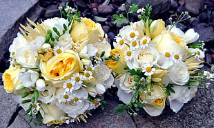 two white-and-yellow rose bouquets