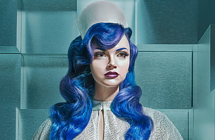 female mannequin in blue wig and white top