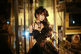 woman wearing black spaghetti strap dress