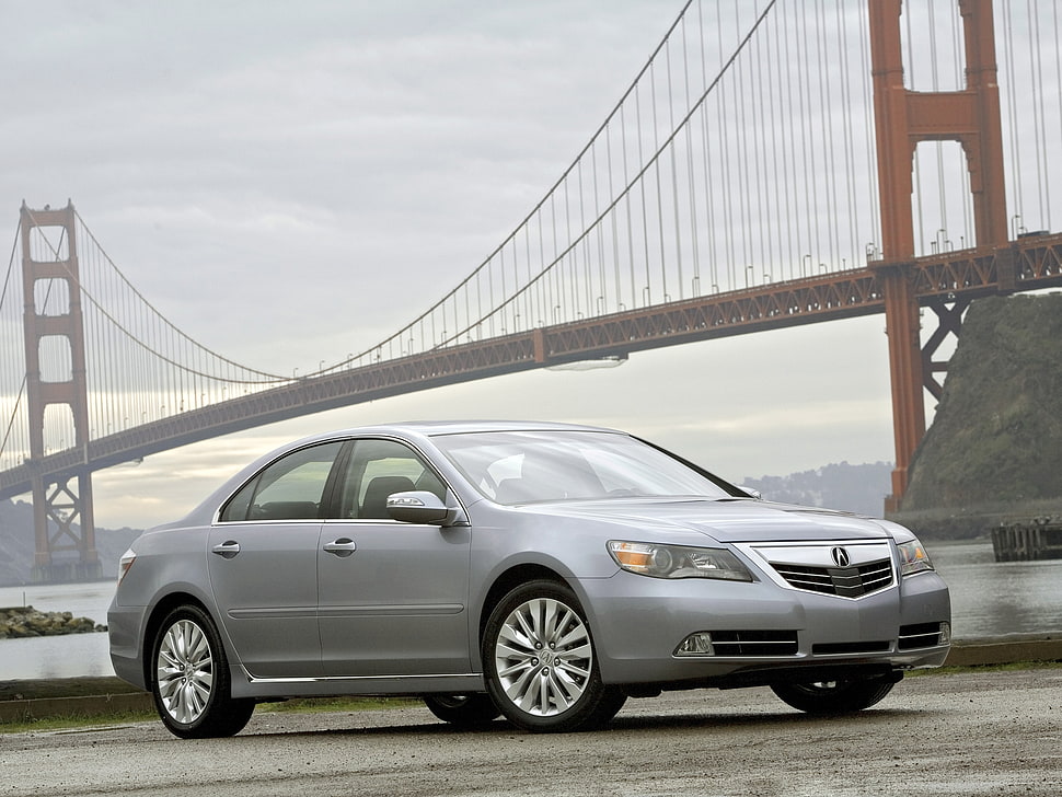silver Acura sedan parked near Golden Gate bridge at daytime HD wallpaper