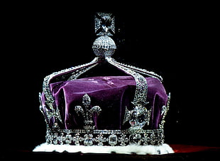 diamond studded silver-colored crown