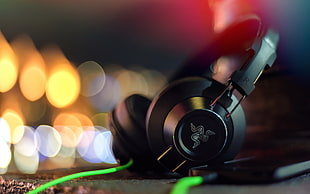selective focus photography of black Razer corded gaming computer headset