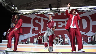 5-man music band wearing red attires
