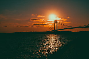 black bridge during sunset