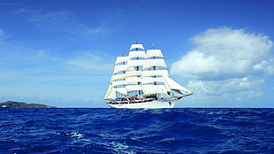 white sailing ship sailing during daytime