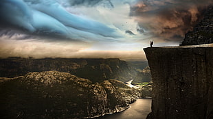 landscape photography of cliff with body of water