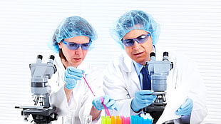two doctor using laboratory apparatus