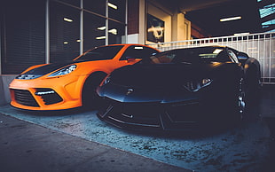two orange and black coupes