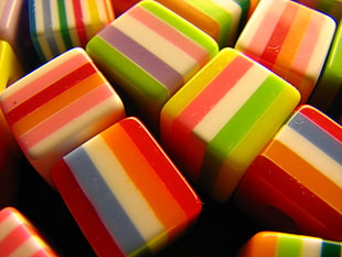closeup photography of colorful cube eraser